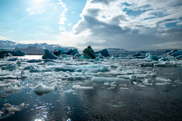Icebergs floating in the lake at Diamond Beach in the summer in Iceland