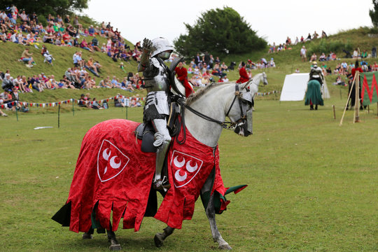 Knight on horseback at a joust recreation for a family day out