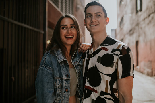 Portrait of young urban couple on street