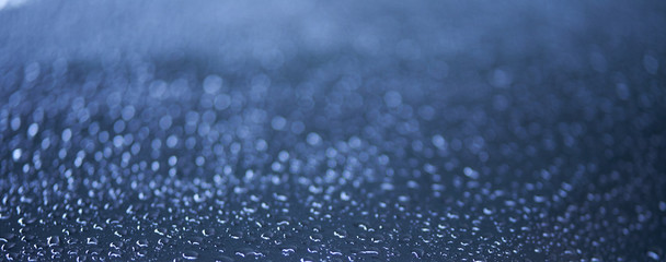 drops of water on glass with bokeh
