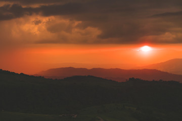 reddish sunset under the mountains