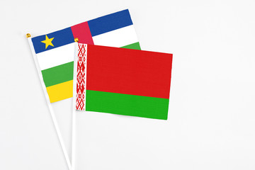 Belarus and Central African Republic stick flags on white background. High quality fabric, miniature national flag. Peaceful global concept.White floor for copy space.