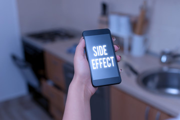 Conceptual hand writing showing Side Effect. Concept meaning typically undesirable effect of a drug or medical treatment woman using smartphone and technological devices inside the home