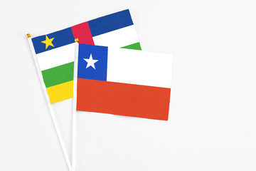 Chile and Central African Republic stick flags on white background. High quality fabric, miniature national flag. Peaceful global concept.White floor for copy space.