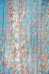 Background texture of old wood with peeling blue paint