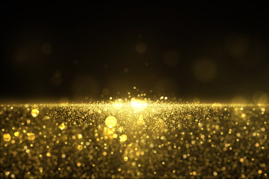 Sparkling golden glitter dust abstract luxury background