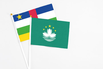 Macao and Central African Republic stick flags on white background. High quality fabric, miniature national flag. Peaceful global concept.White floor for copy space.