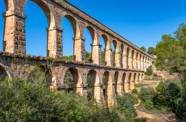 Ancient roman aqueduct Ponte del Diable or Devil's Bridge in Tarragona, Spain.