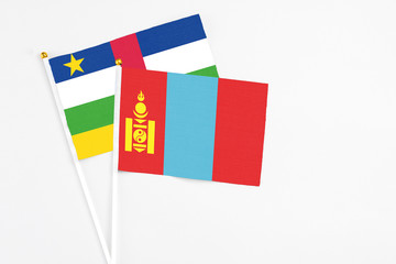 Mongolia and Central African Republic stick flags on white background. High quality fabric, miniature national flag. Peaceful global concept.White floor for copy space.