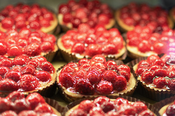 Raspberry cookies with fresh fruits on top.