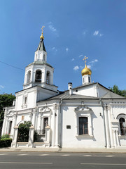 Fototapeta na wymiar Ancient Church of the assumption of the blessed virgin Mary against the blue sky in Moscow in the summer