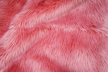 Pink fluffy fur, fashion background. Fashionable rose color fur texture