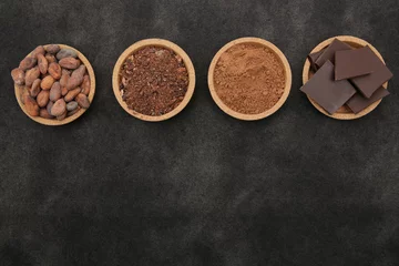Foto op Canvas organic cacao beans, cocoa powder, ground and chocolate on a black background with copy space for text. Flat lay, top view. Ingredient. Vegan food. Background, pattern, card, menu.  © Irina Tarzian