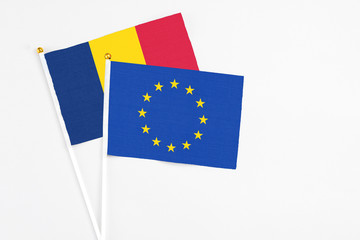 European Union and Chad stick flags on white background. High quality fabric, miniature national flag. Peaceful global concept.White floor for copy space.