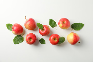 Flat lay with red apples on white background, space for text