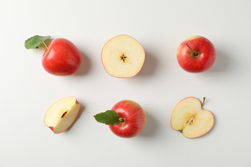Flat lay with red apples on white background, space for text