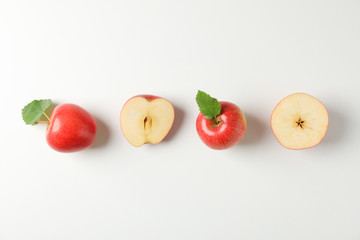 Flat lay with red apples on white background, space for text