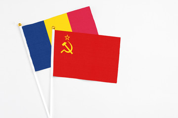 Soviet Union and Chad stick flags on white background. High quality fabric, miniature national flag. Peaceful global concept.White floor for copy space.