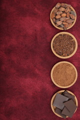organic cacao beans, cocoa powder, ground and chocolate on a red background with copy space for text. Flat lay, top view. Ingredient. Vegan food. Background, pattern, card, menu. Vertical photo.