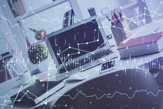 Financial graph colorful drawing and table with computer on background. Double exposure. Concept of international markets.