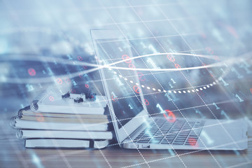 Forex Chart hologram on table with computer background. Multi exposure. Concept of financial markets.
