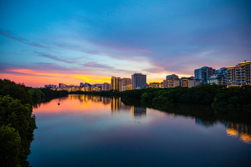 Fototapeta na wymiar Sanya Cityscape with Sanya River View and Apartment Buildings in the sunset time, Hainan Province, China
