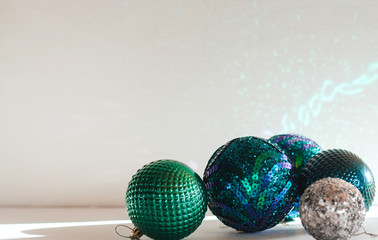  Shiny Christmas balls in green and blue tones.