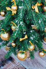 Christmas background. Green fir tree with golden balls and gift boxes. - 302507771