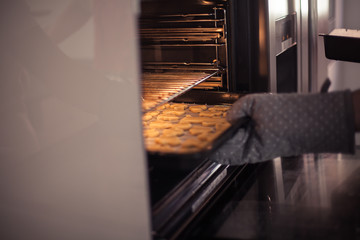 Beautiful family bake christmas cookies. Family cooks in the kitchen. Holidays. Christmas. New Year. Cozy.