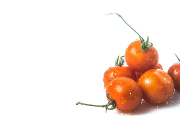 fresh organic cherry tomatoes on white background