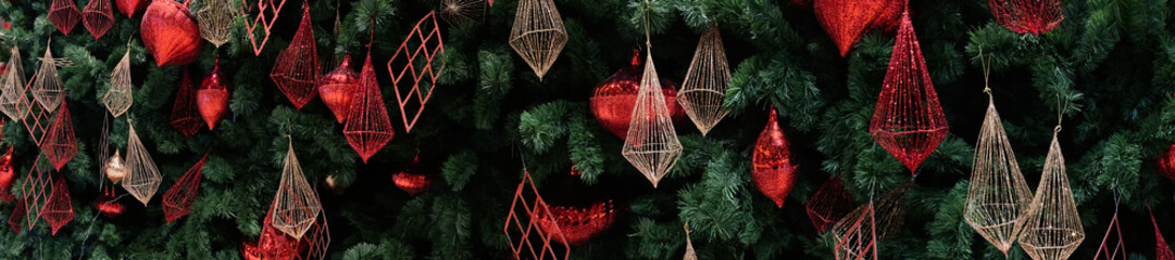 Christmas garland with ornaments and Season Wishes in paronama view.
