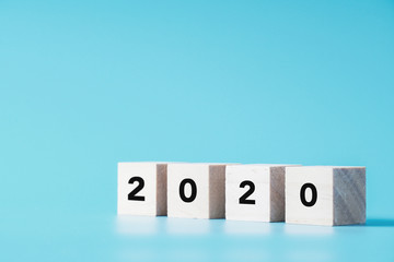 New Year concept with 2020 text on wood cube shape, copy space