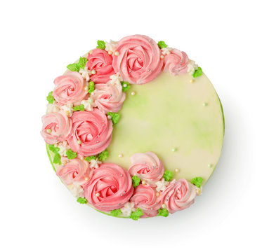 Top view of cream cake decorated with pink roses