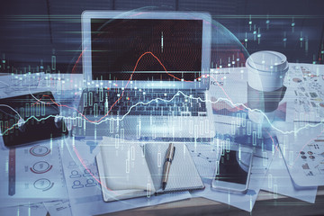 Double exposure of forex graph and work space with computer. Concept of international online trading.