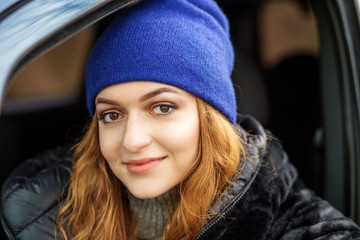 Young woman driving a car. Concept lifestyle, autumn, auto driver.