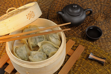 Chinese food, dumplings, chopstics and tea