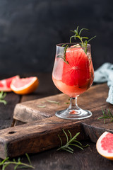 Pink grapefruit drink with rosemary