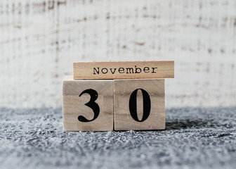 Date of 30 November on wooden cube calendar. Small Business Saturday