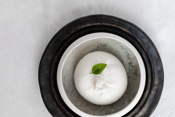 burrata cheese with basil leave top view, white background, copy space