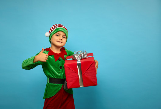 Boy  in Santa's elf costume
