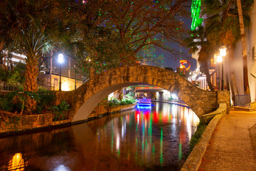 San Antonio River Walk and stone bridge over San Antonio River near Alamo in downtown San Antonio,...