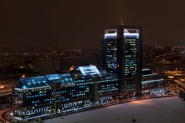 Fototapeta na wymiar Moscow-city business center with lightened windows at night in winter (aerial view)