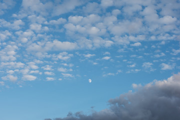 The moon in the blue sky