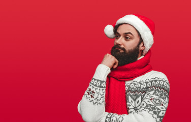 Thoughtful bearded guy during Christmas party