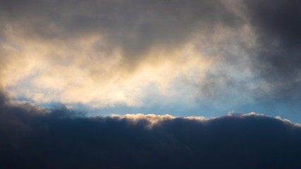 Dramatic sky with dark clouds at sunset_