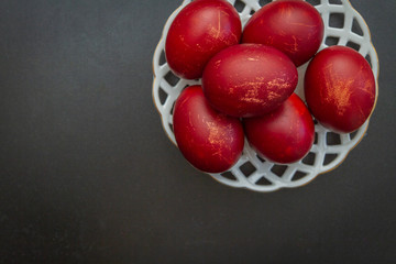 Dyed eggs in onion skins are at the plate