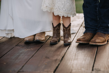 feet of bride, daughter and groom