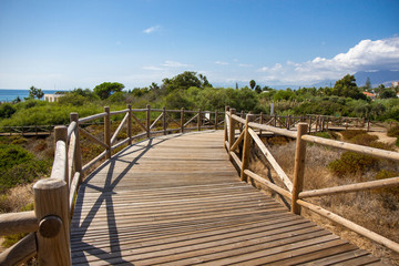 Fototapeta na wymiar Dunas de Artola - Natural Park in Marbella, Costa del Sol-Spain. Wood path , touristic atraction