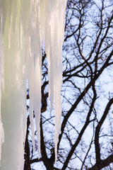 Background Icicles of ice in the winter of a frozen waterfall