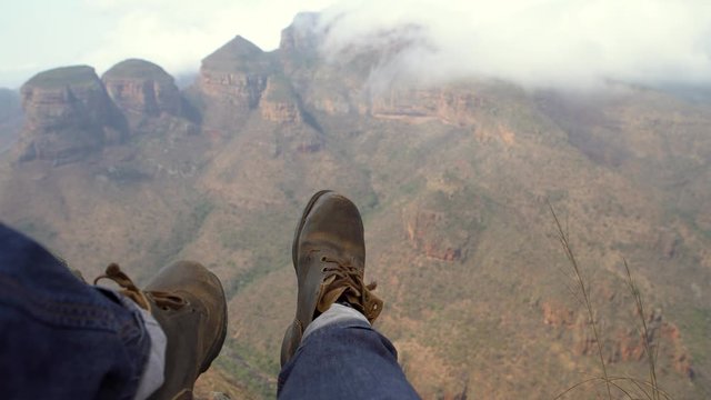 Person sitting by the cliff in Blyde River Canyon